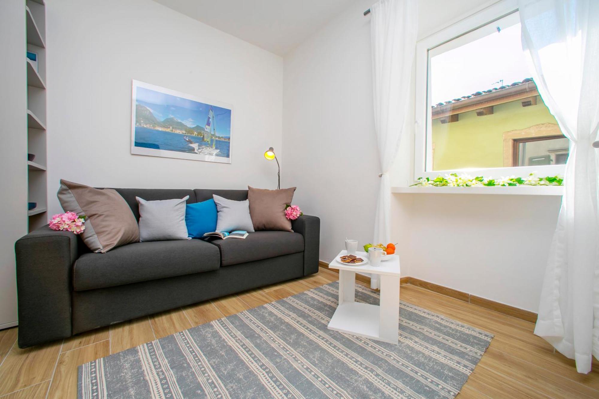 Nido Sui Tetti Di Riva Del Garda - Happy Rentals Extérieur photo