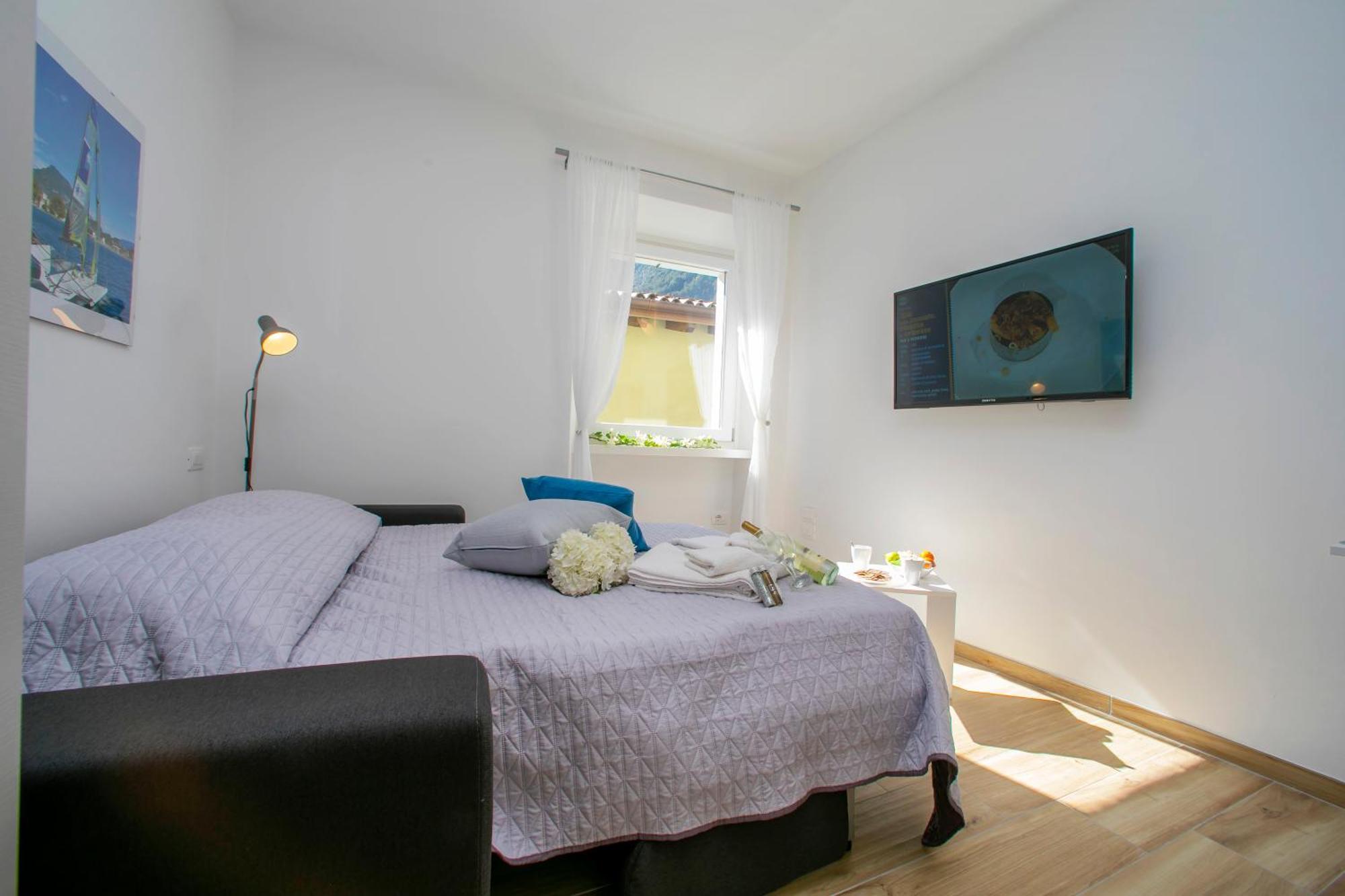 Nido Sui Tetti Di Riva Del Garda - Happy Rentals Extérieur photo